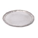 A silver shaped circular salver