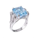 A blue topaz and diamond ring