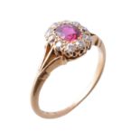 An early 20th century 18 carat gold ruby and diamond cluster ring