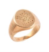 A gold coloured signet ring by Garrard