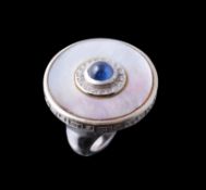 A mother of pearl and sapphire dress ring