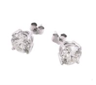 A pair of diamond single stone ear studs