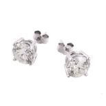 A pair of diamond single stone ear studs