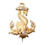 A diamond dolphin and anchor brooch