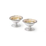 A pair of George III silver pedestal salt cellars by Robert Sharp