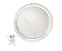 An American silver coloured circular tray by Tiffany & Co.