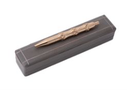 Van Cleef & Arpels, a gold coloured bamboo ball point pen