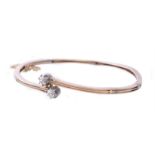 A diamond two stone hinged bangle