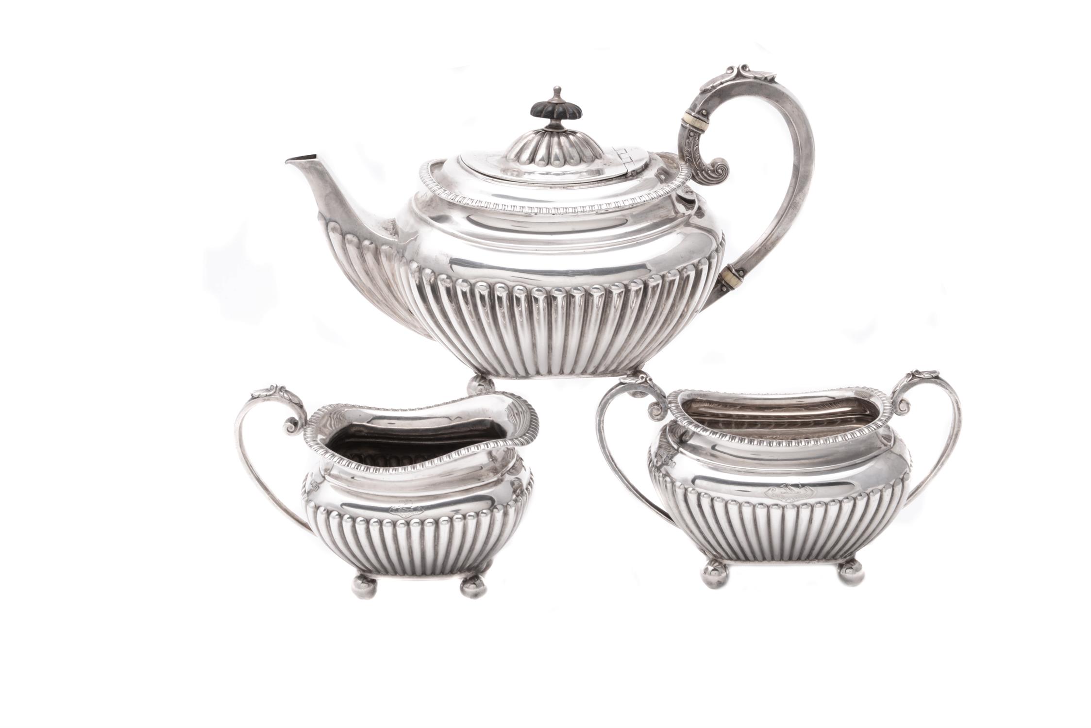A silver three piece oblong tea set by James Dixon & Son