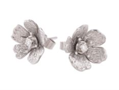 A pair of 18 carat white gold and diamond flower head ear studs