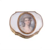 A gilt metal and mother of pearl cartouche shape snuff box