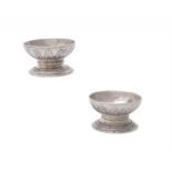 A pair of William IV silver circular pedestal salts by R. & S. Garrard & Co.
