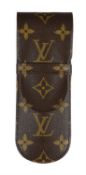 Louis Vuitton, a black lacquer rollerball pen and leather monogram pen holder