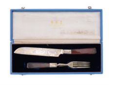 A Victorian silver gilt melon cutting knife and fork by H. J. Lias & Son