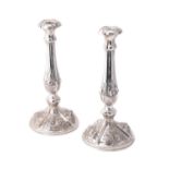 A pair of Austrian silver circular candlesticks
