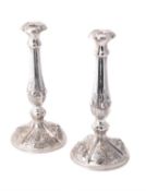 A pair of Austrian silver circular candlesticks