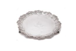 A silver shaped circular salver by Walker & Hall
