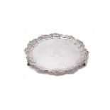 A silver shaped circular salver by Walker & Hall