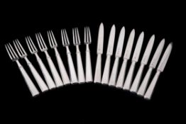 A set of eight Art Deco silver fruit knives and forks by The Goldsmiths & Silversmiths Co. Ltd