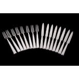 A set of eight Art Deco silver fruit knives and forks by The Goldsmiths & Silversmiths Co. Ltd