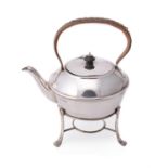 A silver circular tea pot on stand by Harrison Brothers & Howson