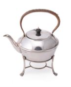 A silver circular tea pot on stand by Harrison Brothers & Howson