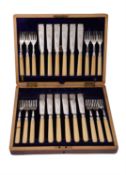 A cased set of twelve silver and ivory handled fish knives and forks by Martin, Hall & Co.