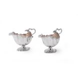 A pair of George III silver shell moulded sauce boats