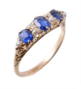 An early 20th century diamond and sapphire carved half hoop ring