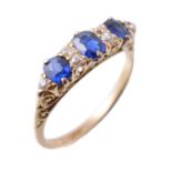 An early 20th century diamond and sapphire carved half hoop ring