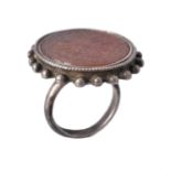 An early 20th century cornelian and silver ring