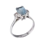 An aquamarine and diamond three stone ring