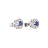 A pair of sapphire and diamond cluster ear studs