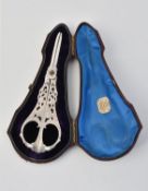 A cased pair of Victorian silver grape scissors by Josiah Williams & Co.