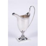 A George III silver helmet shaped cream jug by Charles Hougham