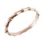 A 9 carat gold bamboo hinged bangle