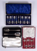 A cased set of twelve silver engraved tea spoons and sugar tongs by John Round & Son