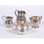 A silver baluster cream jug by Wakely & Wheeler
