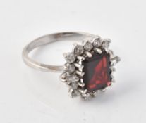 A garnet and diamond cluster ring