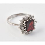 A garnet and diamond cluster ring