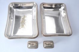 A pair of electro-plated rectangular entree dishes and covers with matched silver handles