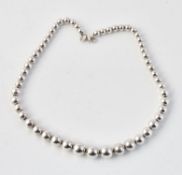 A silver bead link collar necklace by Tiffany & Co.