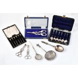 A collection of silver flatware