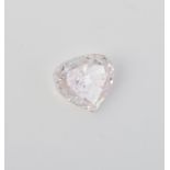 † An un-mounted light pink coloured diamond