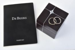 A diamond 'Forvever' court ring by De Beers