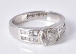 A diamond single stone band ring