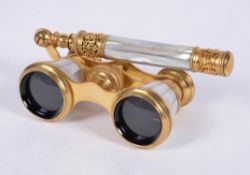 Y A pair of gilt metal and mother of pearl opera glasses