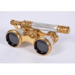 Y A pair of gilt metal and mother of pearl opera glasses