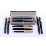 Parker, eight black fountain pens and a propelling pencil