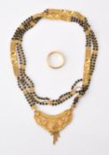 An Indian beaded gold coloured necklace